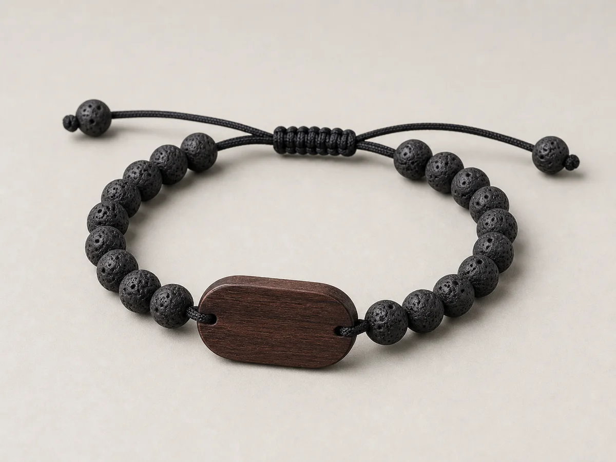 Adjustable black volcanic stone-bead RFID wristband with a dark wood faceplate