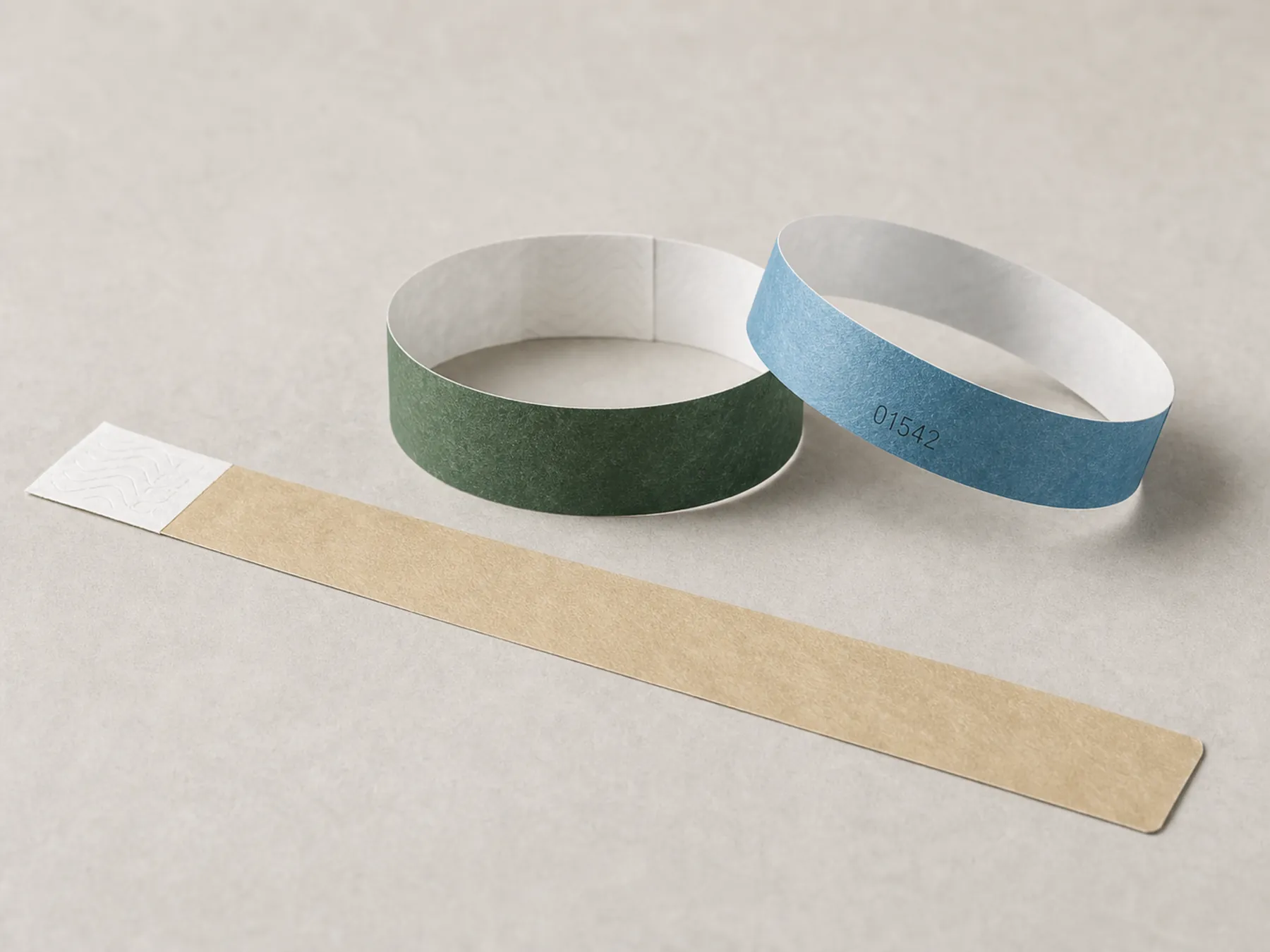 Coated paper RFID day-pass wristbands in three restrained colours